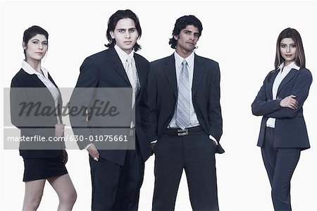 Portrait of two businessmen and two businesswomen standing