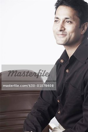 Side profile of a businessman smiling