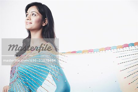 Side profile of a young woman looking up