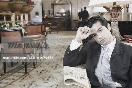 Portrait of a businessman sitting in a hotel lobby