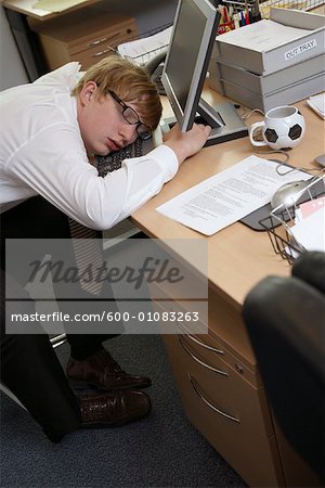 Businessman Asleep at Desk