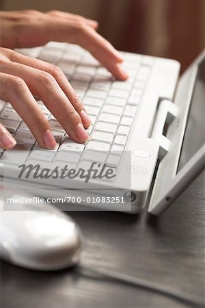 Close-up of Woman's Hands Typing