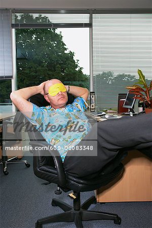 Office Worker Sleeping at Desk