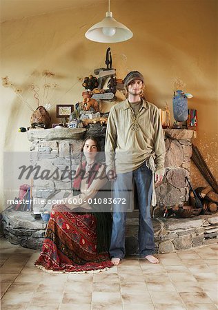 Hippie Couple in Front of Fireplace