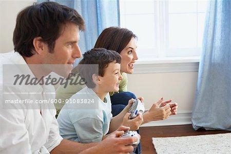 Father, Mother and Son Playing Video Game