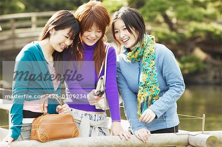 Three young women smiling