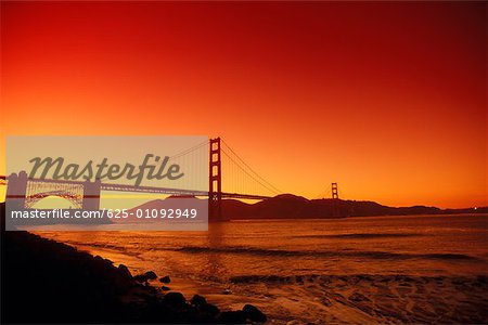 Silhouette of a suspension bridge Golden Gate Bridge, San Francisco California, USA