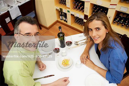 High angle view of a mid adult couple sitting at a table in a restaurant