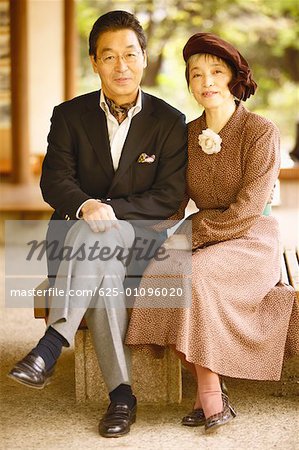 Portrait of a senior man and a mature woman sitting together