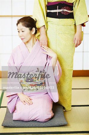 Two women wearing Kimonos