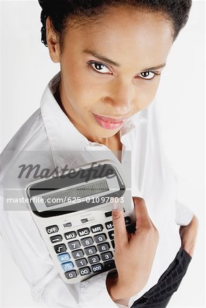 Portrait of a businesswoman holding a calculator