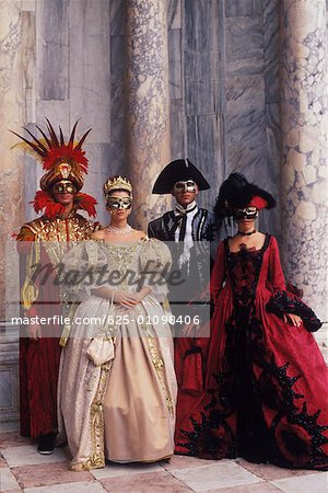Two men and two women wearing costumes, Venice, Veneto, Italy