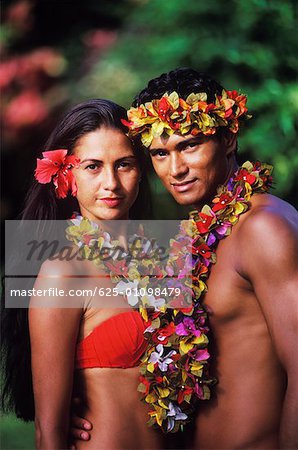 Portrait of a young couple standing together, Hawaii, USA