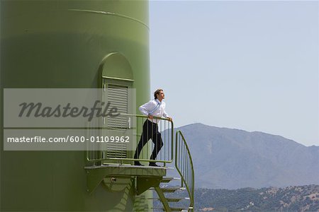 Businessman on Platform of Wind Turbine