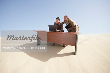 Business People Working in Desert