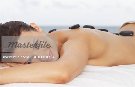 Woman Getting Warming Rock Therapy