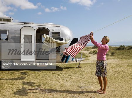 Woman Hanging Laundry on Clothesline