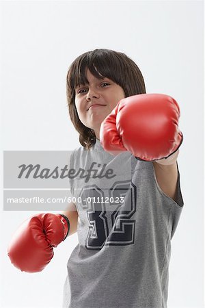Portrait of Boy Wearing Boxing Gloves
