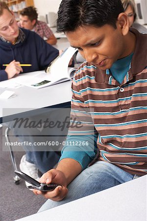 Student Using Cell Phone in Classroom