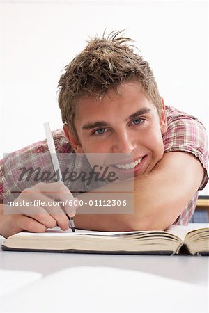 Male Student with Textbook