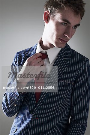 Young Man Loosening Tie