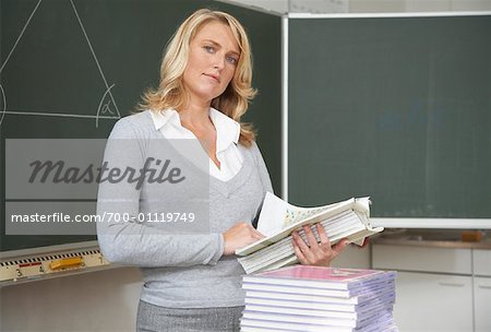 Teacher Holding Student Test Papers