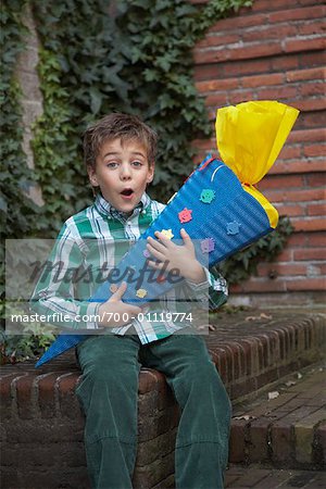 Portrait of Boy Holding Gift