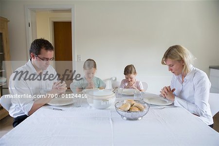 Family Praying Before Meal