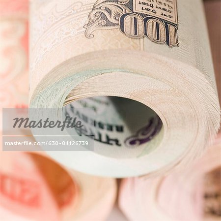 Close-up of a stack of rolled up Indian banknotes