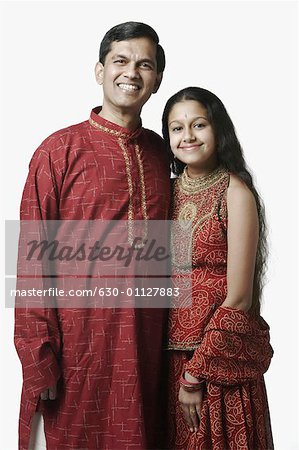 Portrait of a mature man and his daughter smiling