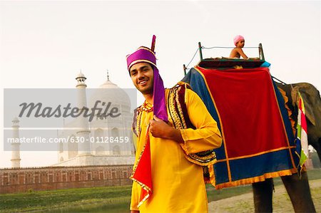 Portrait of a young man standing on the riverbank, Taj Mahal, Agra Uttar Pradesh, India