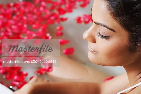 Close-up of a young woman in a bathtub