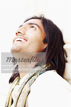 Close-up of a young man looking cheerful