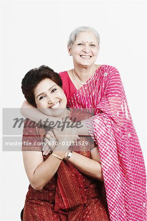 Portrait of a mature woman and her daughter smiling