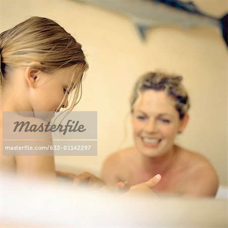 Woman and girl in bathtub