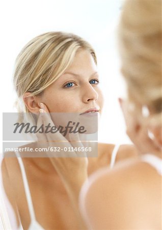 Woman's reflection in mirror, head and shoulders