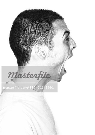 Young man screaming, profile