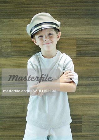 Boy wearing captain's hat