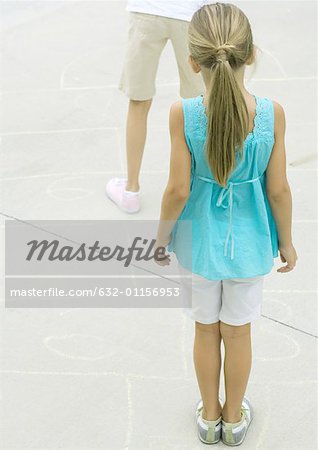 Girls playing hopscotch