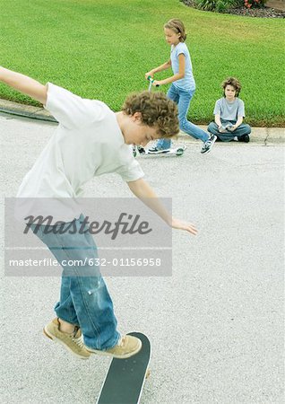 Suburban children playing in street