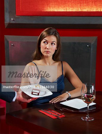Woman Declining Cigarettes from Waiter