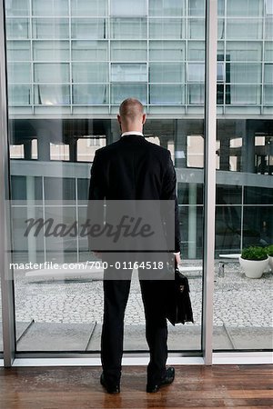 Businessman Looking Out Window