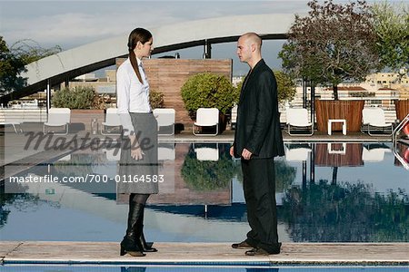Business People Standing by Swimming Pool