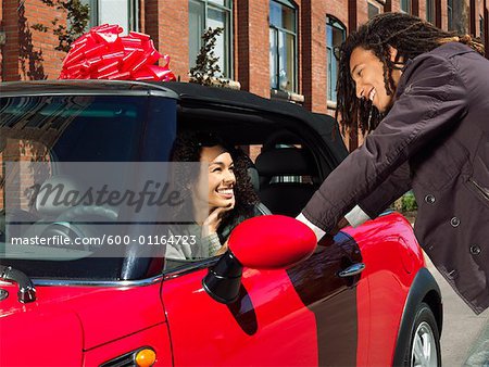 Man Giving Woman New Car