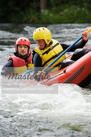 Two people white water rafting