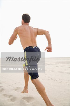 Man Running on Beach