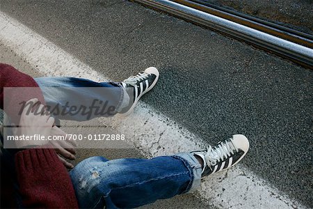 Man Sitting on Road