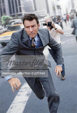 Man Running From Paparazzi