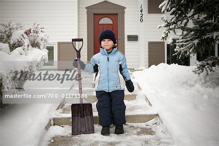 Portrait of Boy Holding Shovel