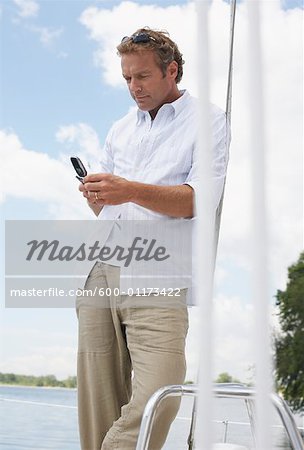 Man with Cellular Phone on Boat